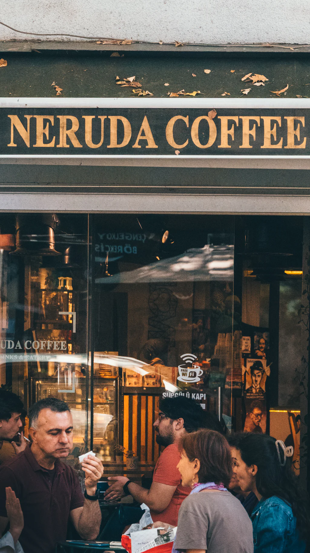 People sitting outside Neruda Coffee shop enjoying their time.